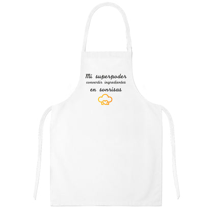 Delantal de cocina "Mi superpoder, convertir ingredientes en sonrisas". Blanco.